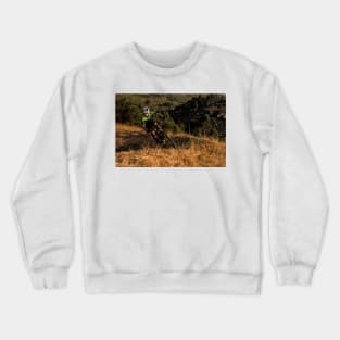 Mountain Biker riding a single track at sunset Crewneck Sweatshirt